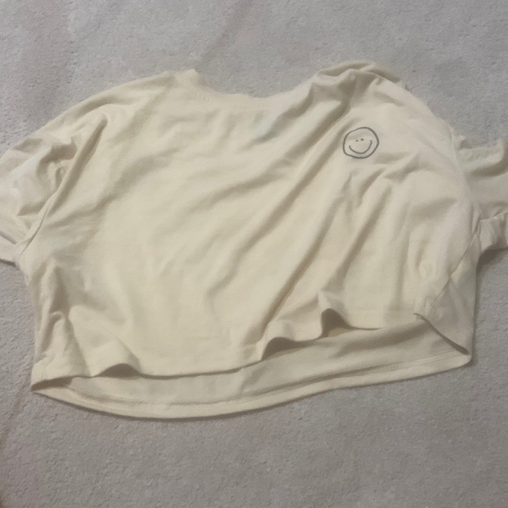 Yellow/orange crop top with smile face